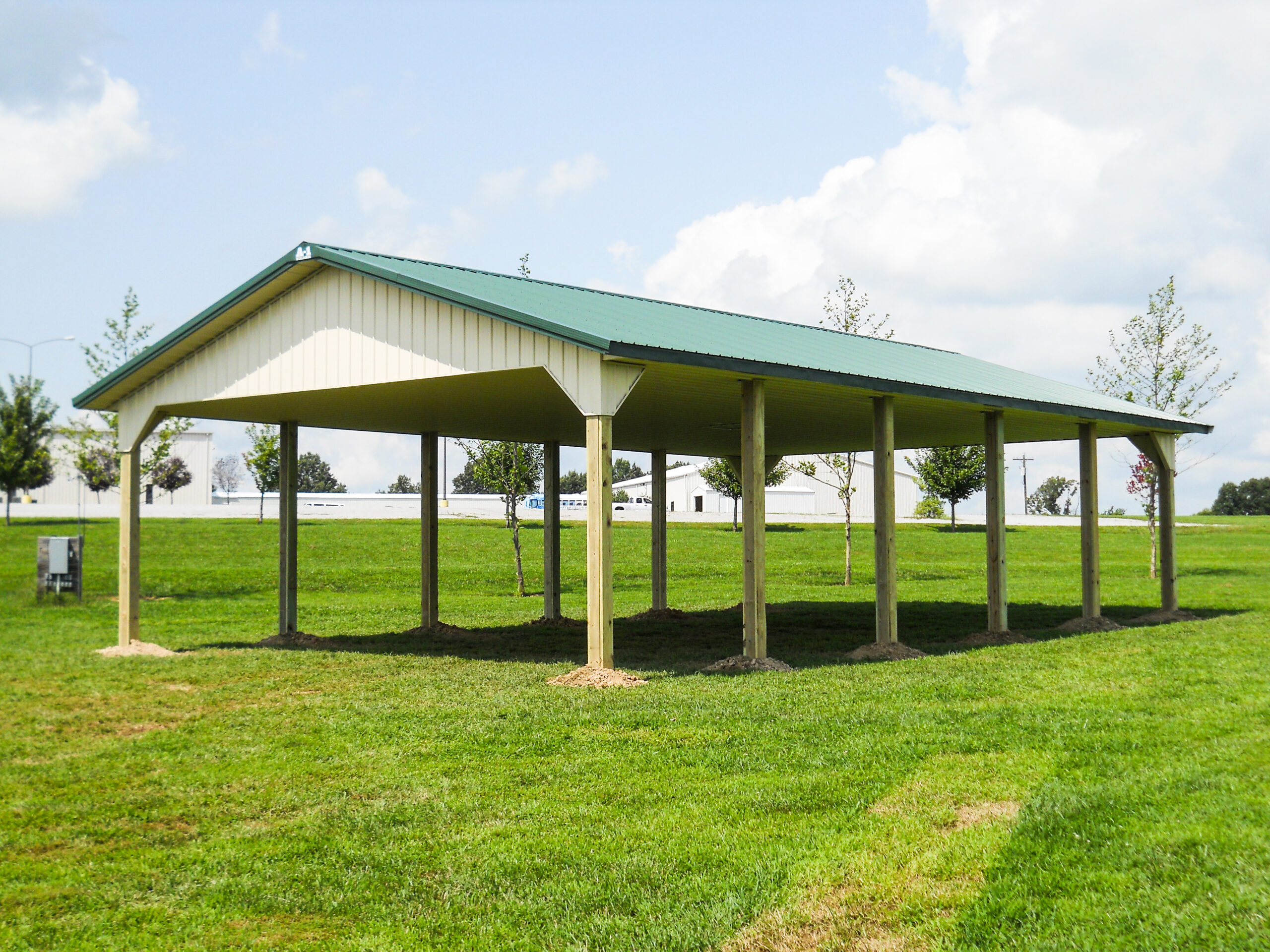 Green roof, tan pavillion structure with posts in Marion, Illinois